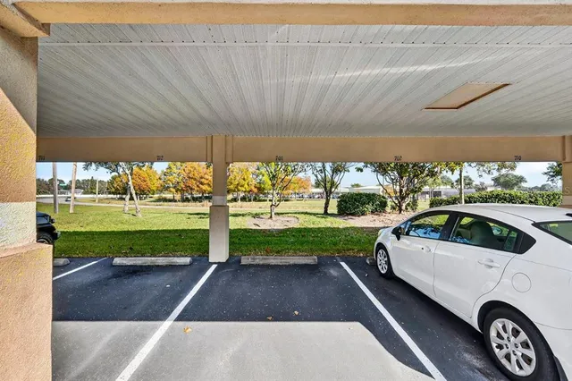 a swimming pool with outdoor seating and yard