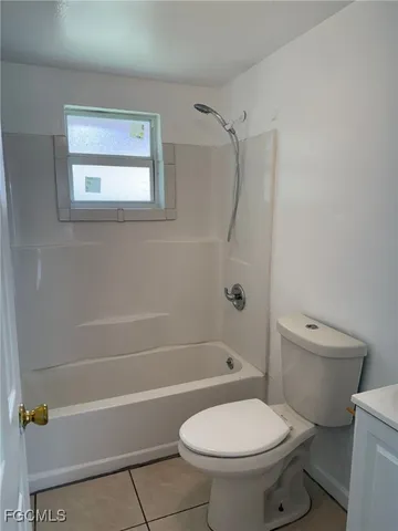 a bathroom with a toilet and a bathtub
