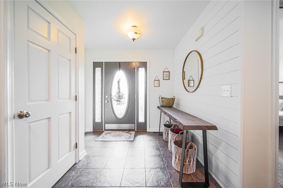 9554 Dover Road Apple Creek, OH 44606 - Photo 31 of 45 Foyer entrance featuring wood walls