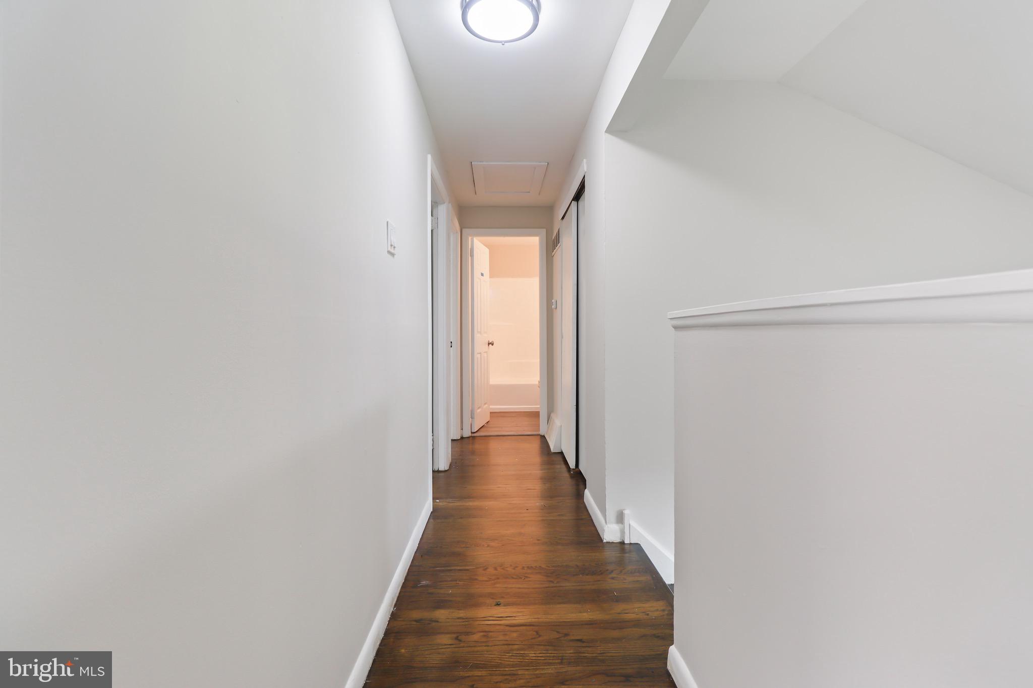 197 Pine Avenue Salem, NJ 08079 - Photo 11 of 20 a view of a hallway with wooden floor and staircase
