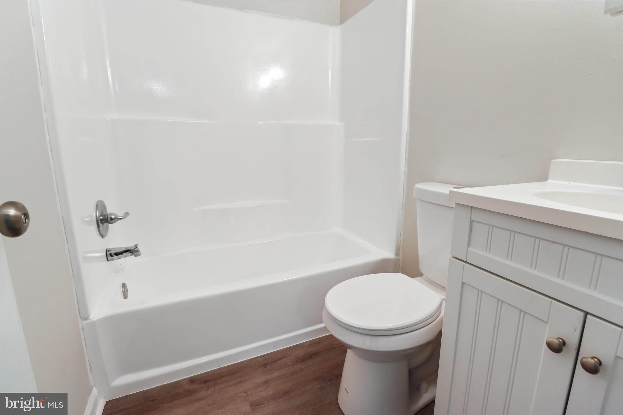 197 Pine Avenue Salem, NJ 08079 - Photo 14 of 20 a bathroom with a toilet a sink and bathtub