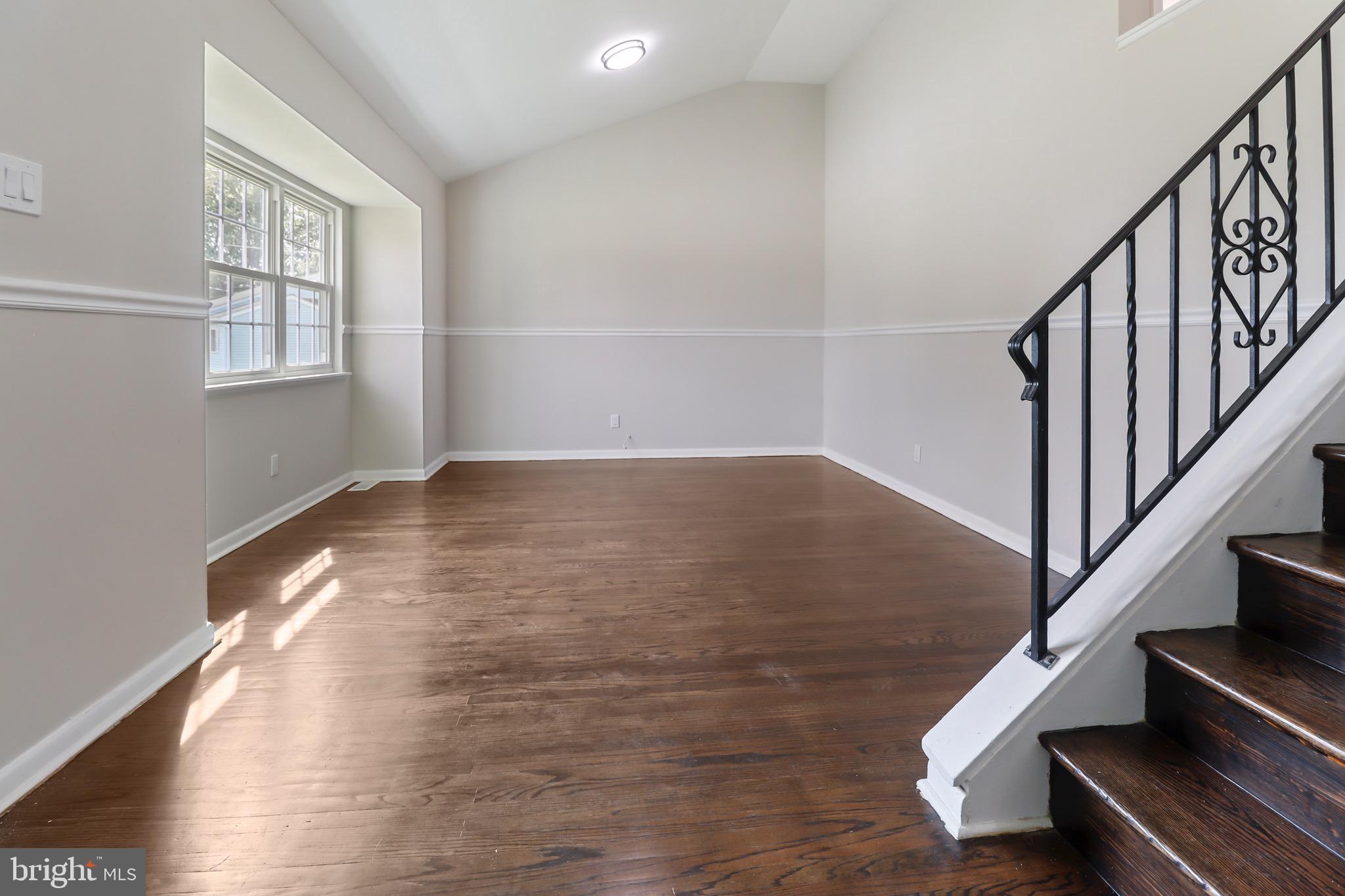 197 Pine Avenue Salem, NJ 08079 - Photo 6 of 20 a view of an empty room with wooden floor and a window