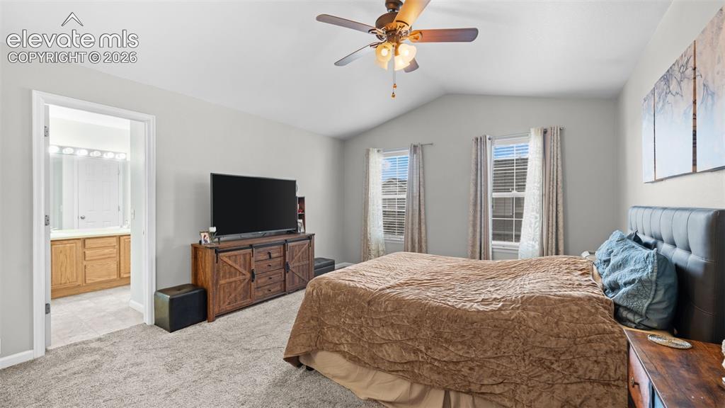 4023 Diamond Ridge View Colorado Springs, CO 80918 - Photo 25 of 31 a bedroom with a bed and a flat screen tv