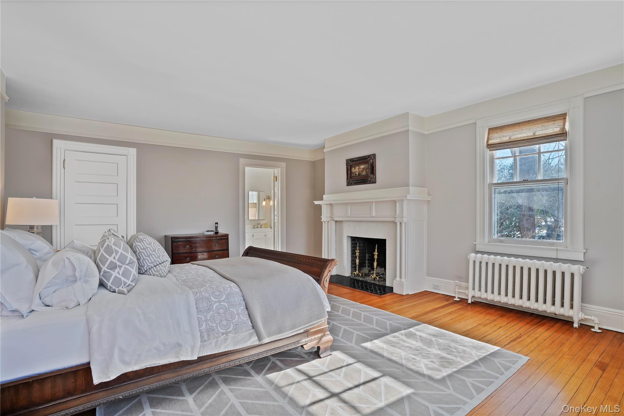 534 Pelham Manor Road Pelham, NY 10803 - Photo 22 of 44 Master bedroom with wood-burning fireplace