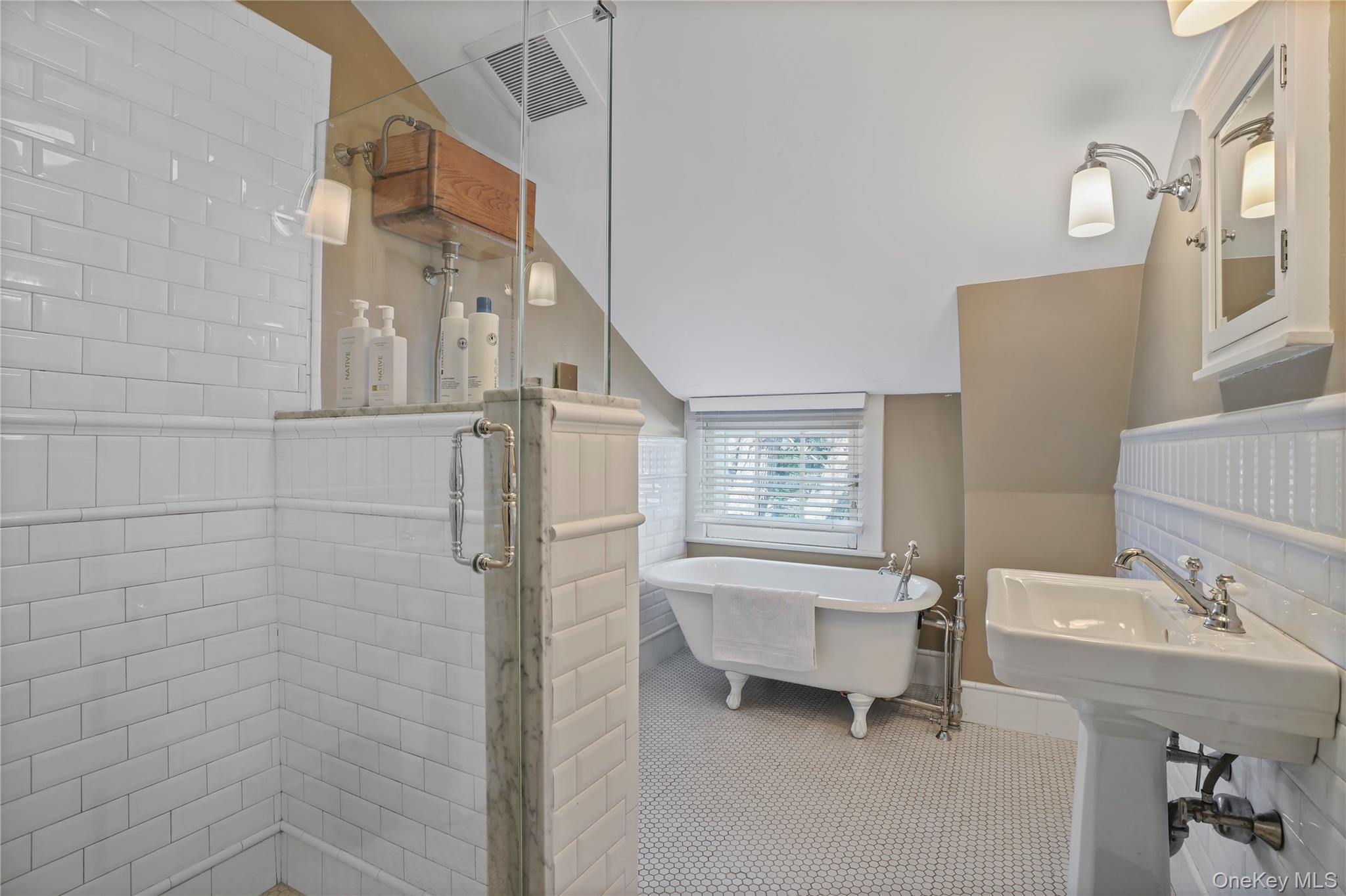 534 Pelham Manor Road Pelham, NY 10803 - Photo 32 of 44 Third floor bathroom with cast iron, claw foot tub, separate shower, and restored pull chain toilet