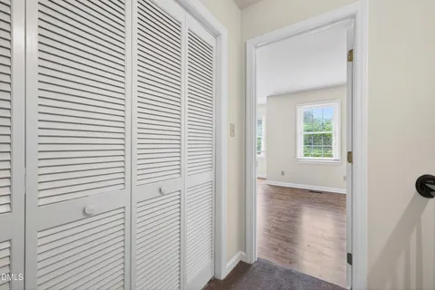 a view of a hallway with front door