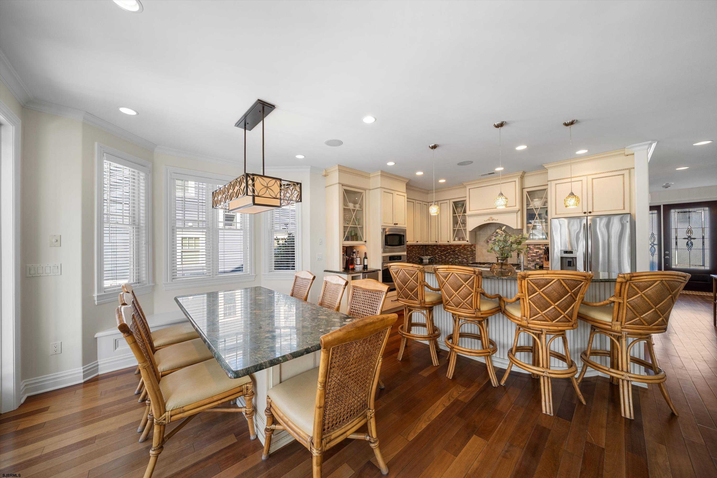 165 Pinnacle Road Ocean City, NJ 08226 - Photo 15 of 34 a view of a dining room with furniture wooden floor and chandelier