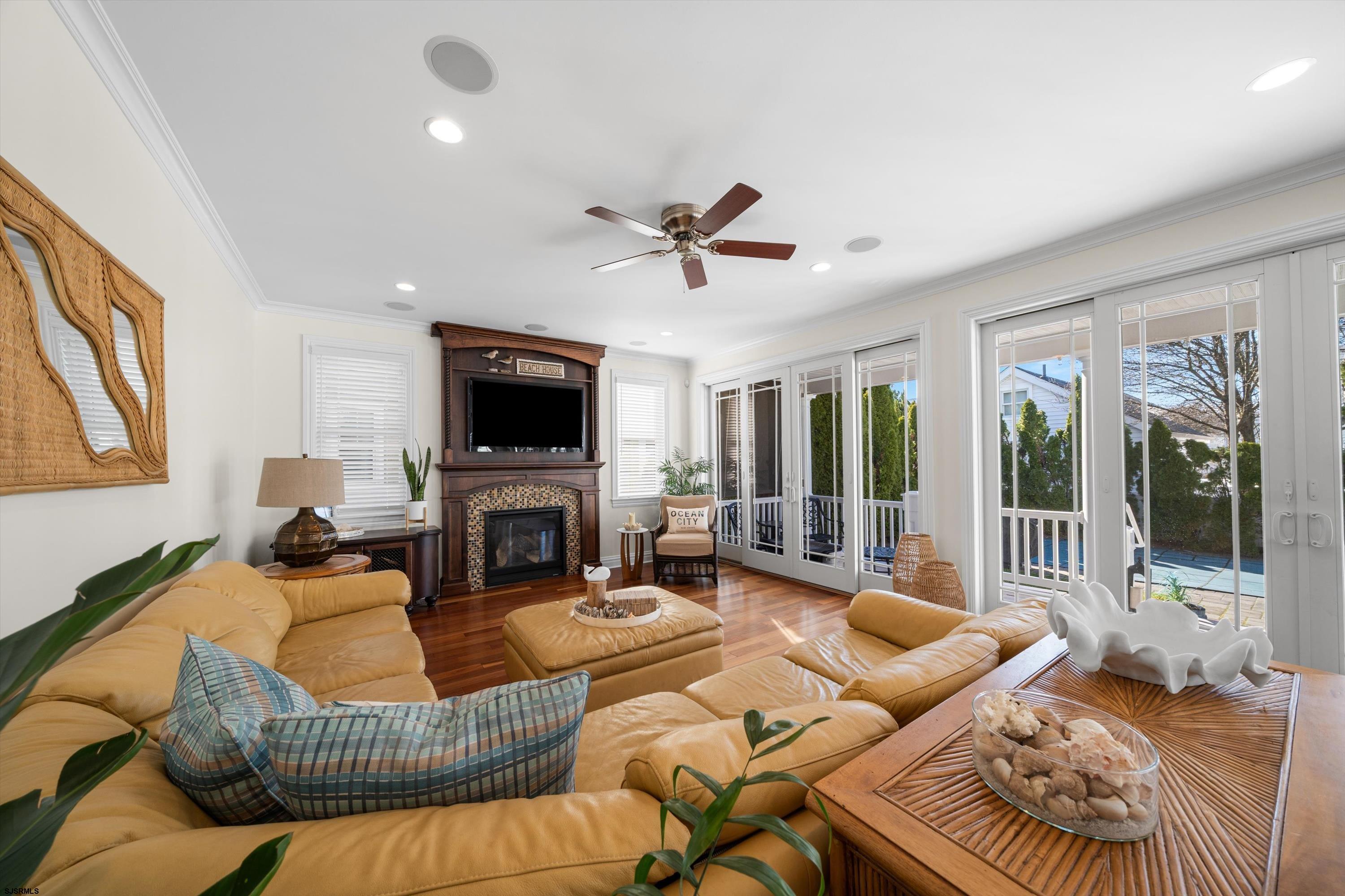 165 Pinnacle Road Ocean City, NJ 08226 - Photo 17 of 34 a living room with furniture fireplace and a flat screen tv