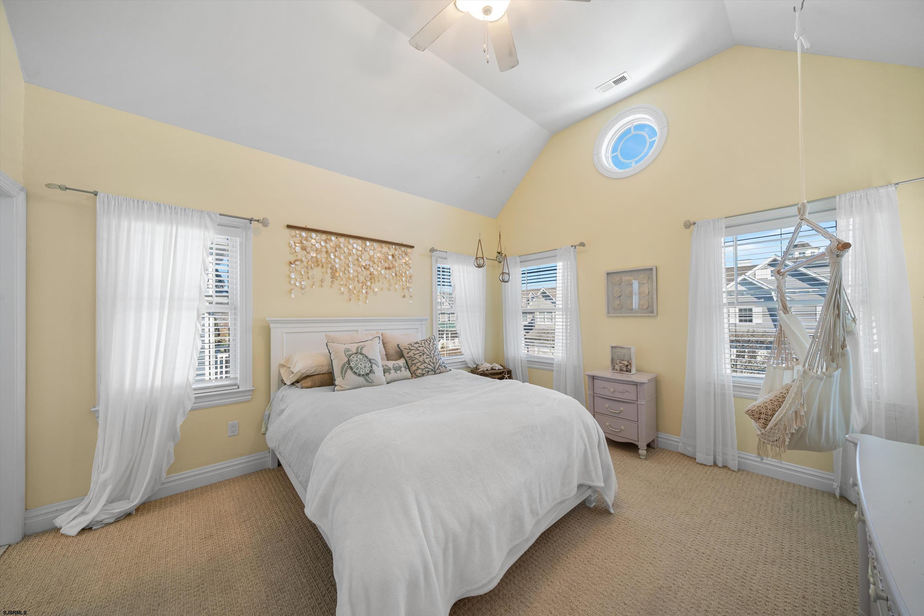 165 Pinnacle Road Ocean City, NJ 08226 - Photo 27 of 34 a bedroom with a bed and a painting on the wall