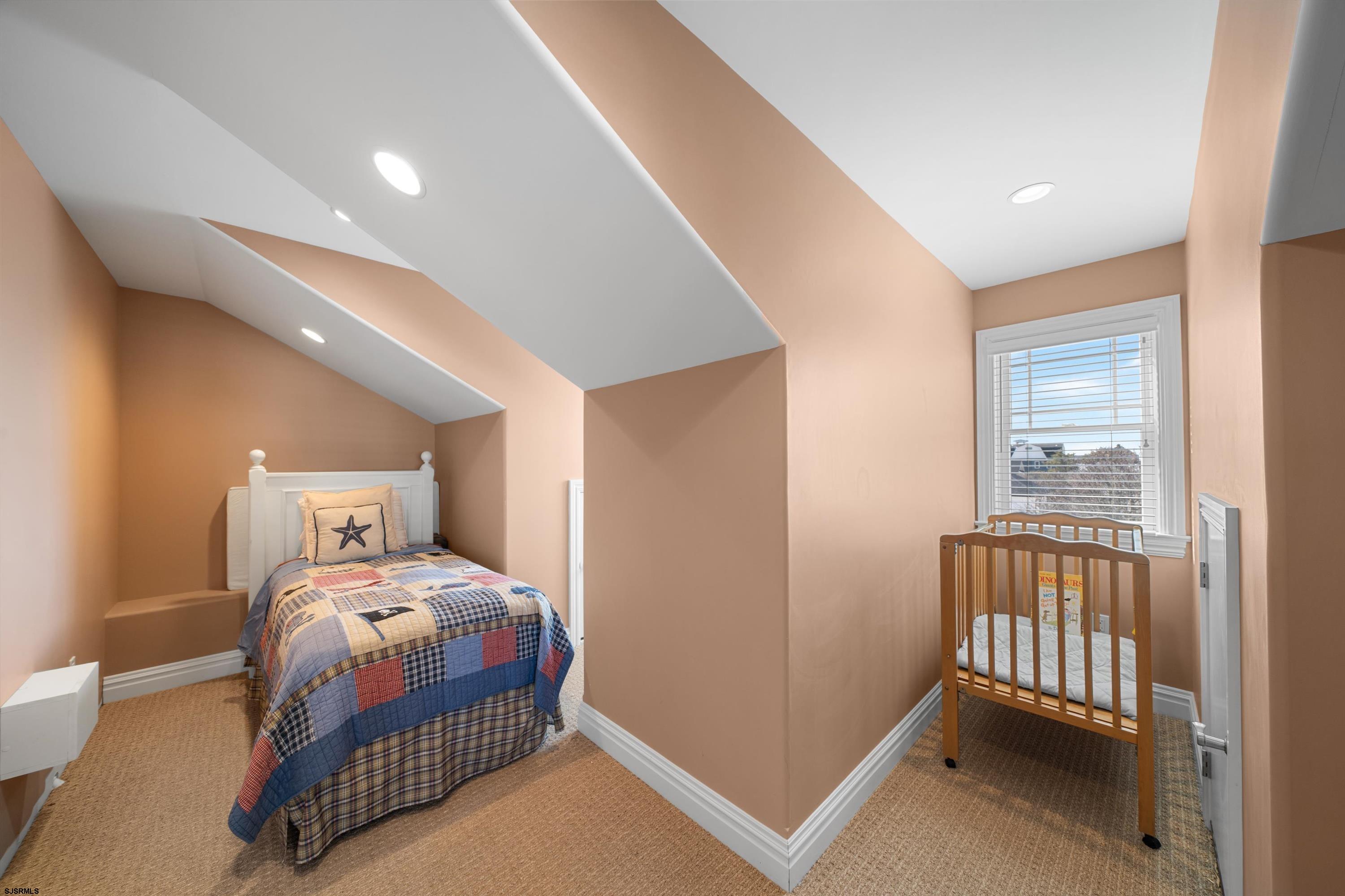 165 Pinnacle Road Ocean City, NJ 08226 - Photo 32 of 34 a bedroom with a bed and a window