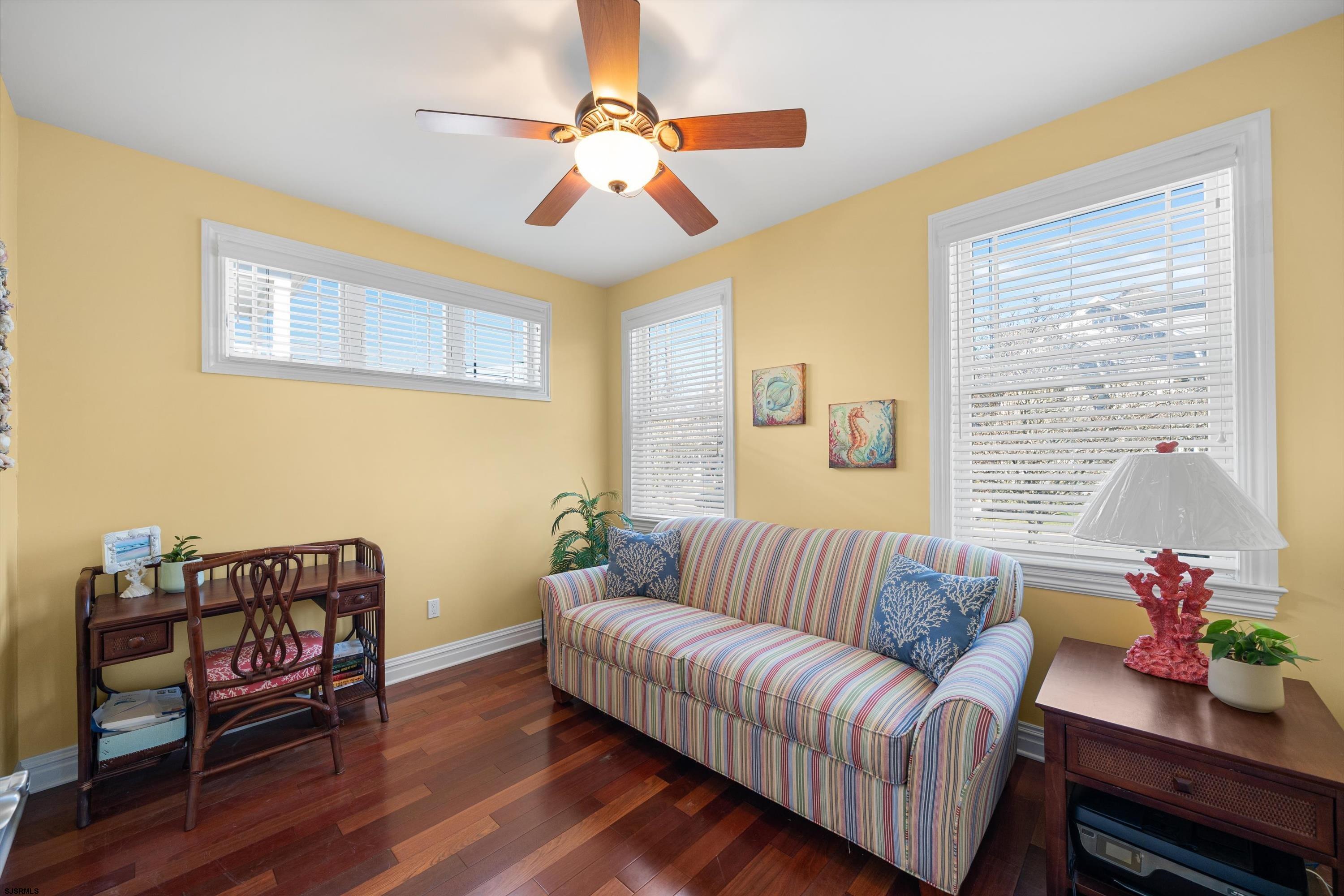 165 Pinnacle Road Ocean City, NJ 08226 - Photo 6 of 34 a living room with furniture stairs and a window
