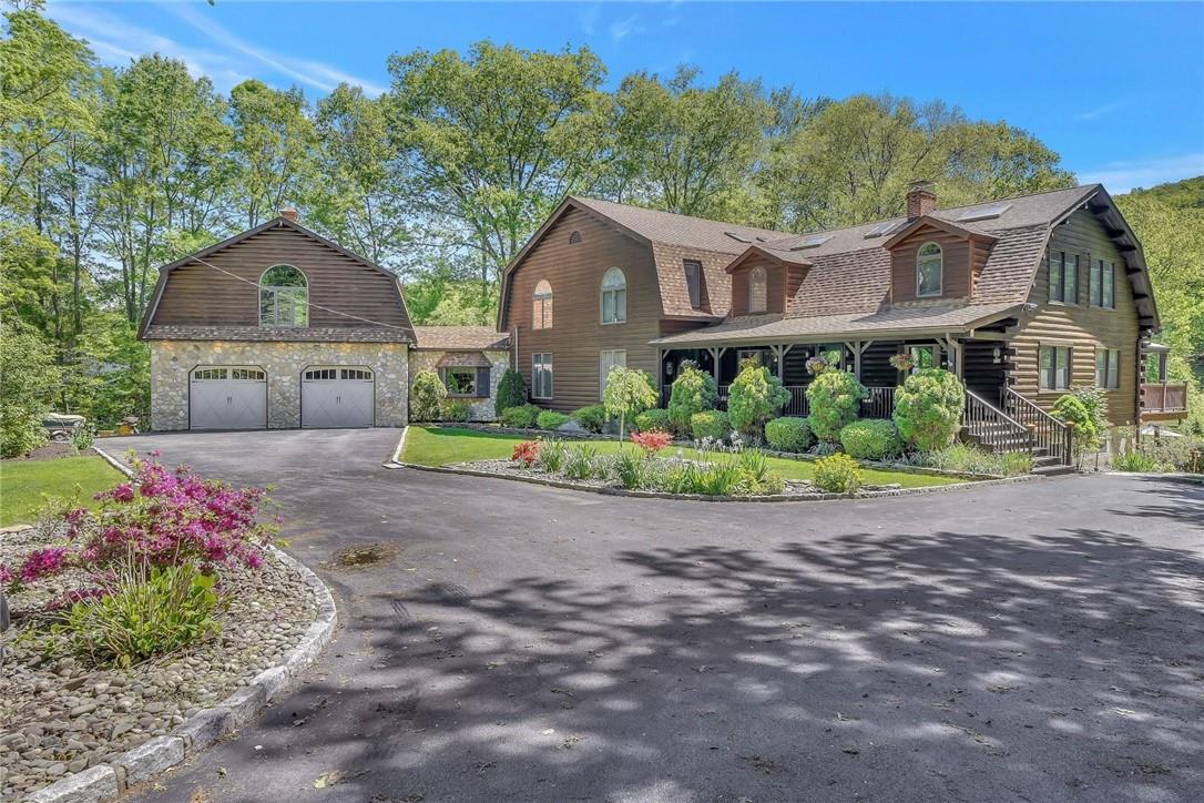 372 Nelson Road Monroe, NY 10950 - Photo 1 of 1 a front view of house with a garden