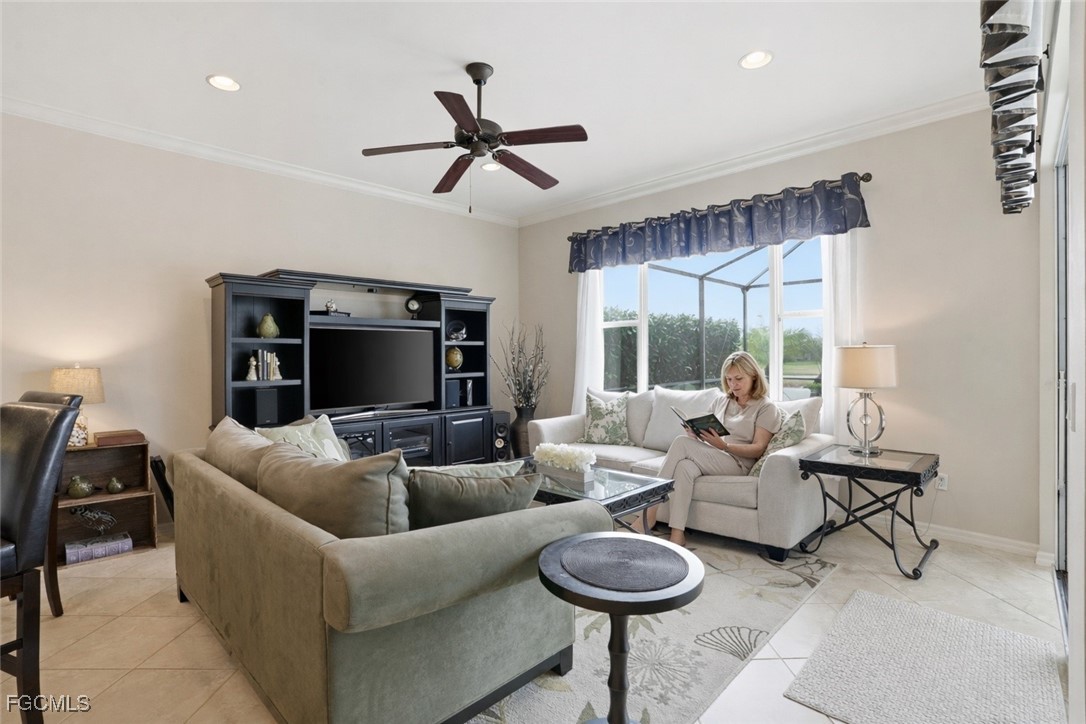 20604 Chestnut Ridge Drive North Fort Myers, FL 33917 - Photo 15 of 49 a living room with furniture and a flat screen tv