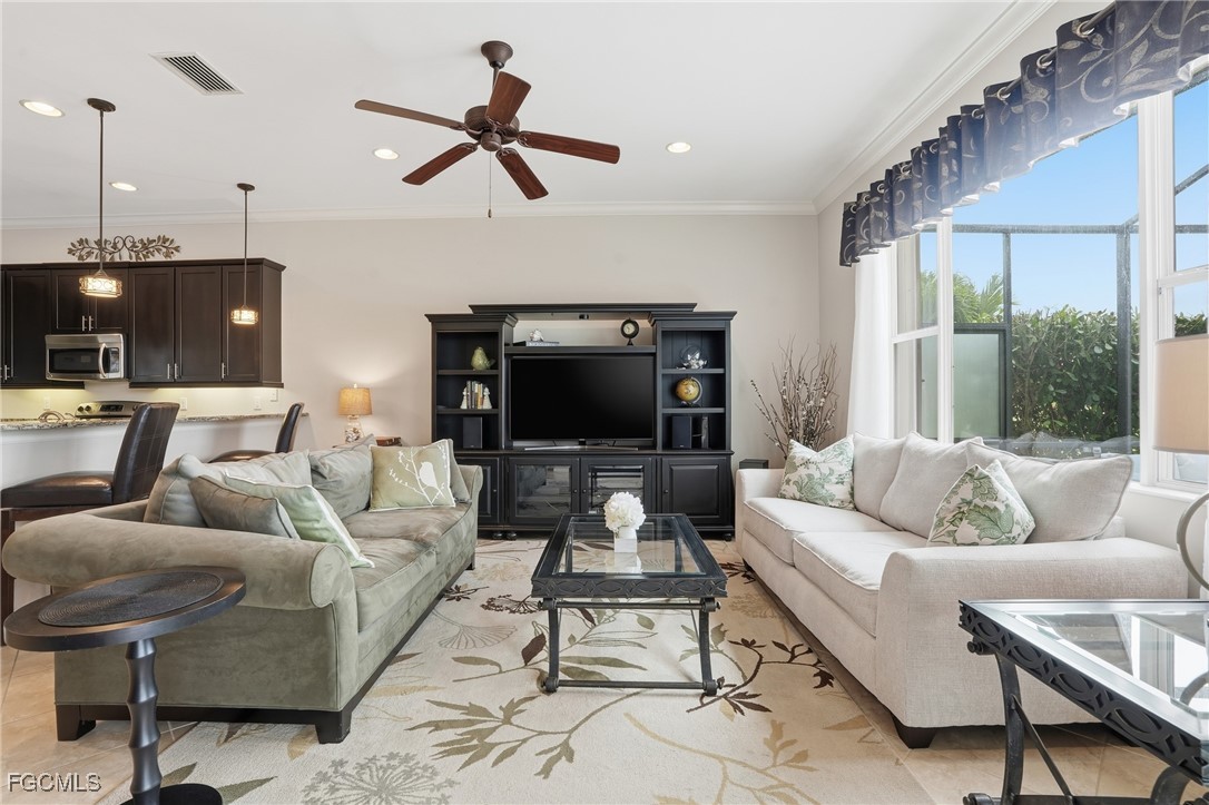 20604 Chestnut Ridge Drive North Fort Myers, FL 33917 - Photo 16 of 49 a living room with furniture and a flat screen tv