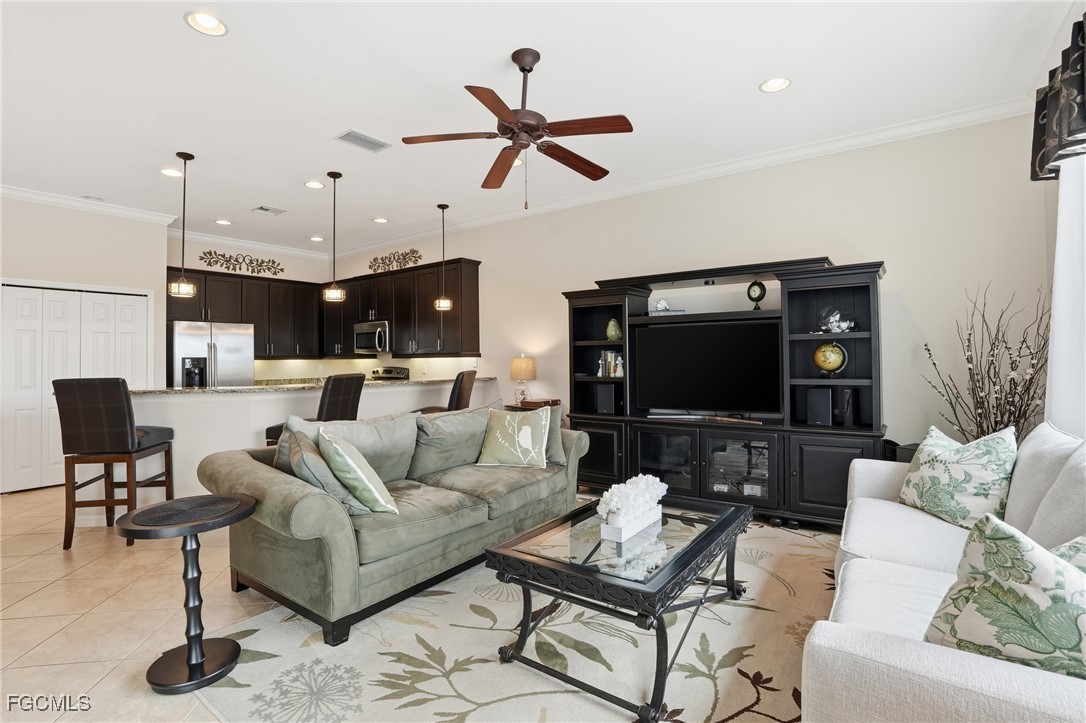 20604 Chestnut Ridge Drive North Fort Myers, FL 33917 - Photo 17 of 49 a living room with furniture and a flat screen tv
