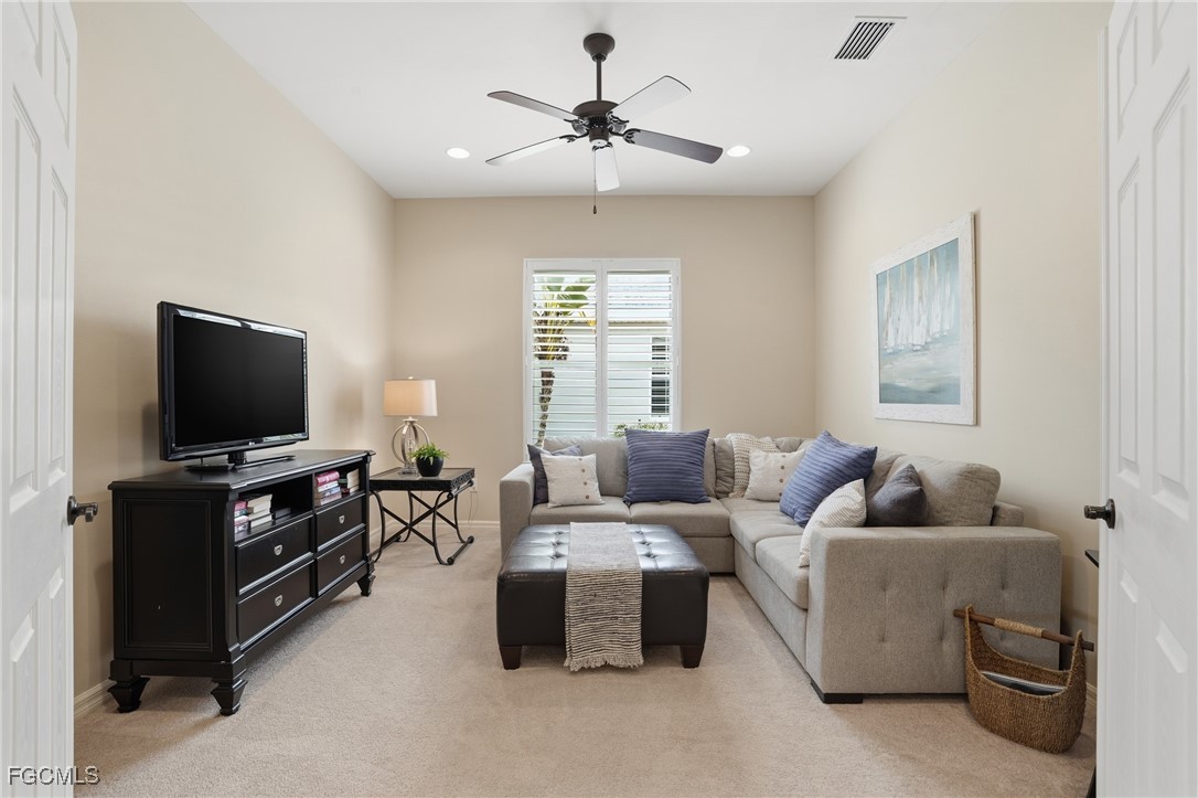 20604 Chestnut Ridge Drive North Fort Myers, FL 33917 - Photo 18 of 49 a living room with furniture and a flat screen tv