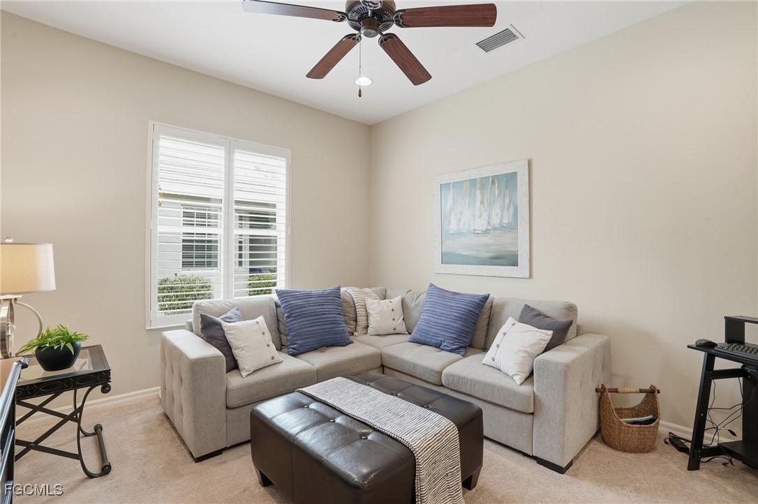 20604 Chestnut Ridge Drive North Fort Myers, FL 33917 - Photo 19 of 49 a living room with furniture and a large window