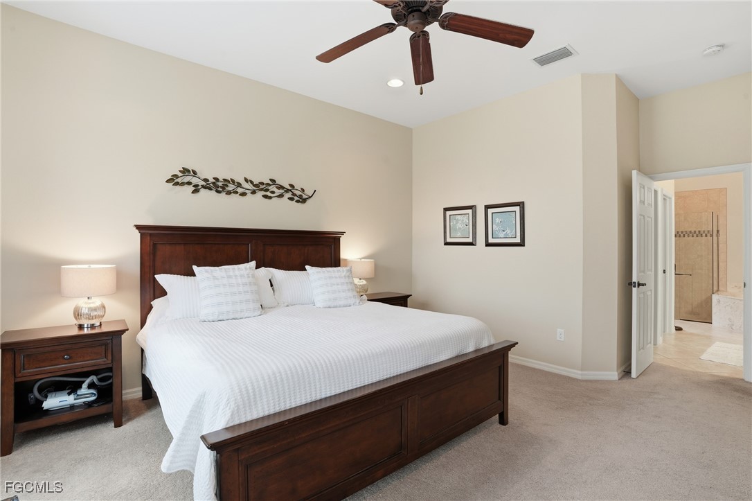 20604 Chestnut Ridge Drive North Fort Myers, FL 33917 - Photo 22 of 49 a bedroom with a bed and a tv