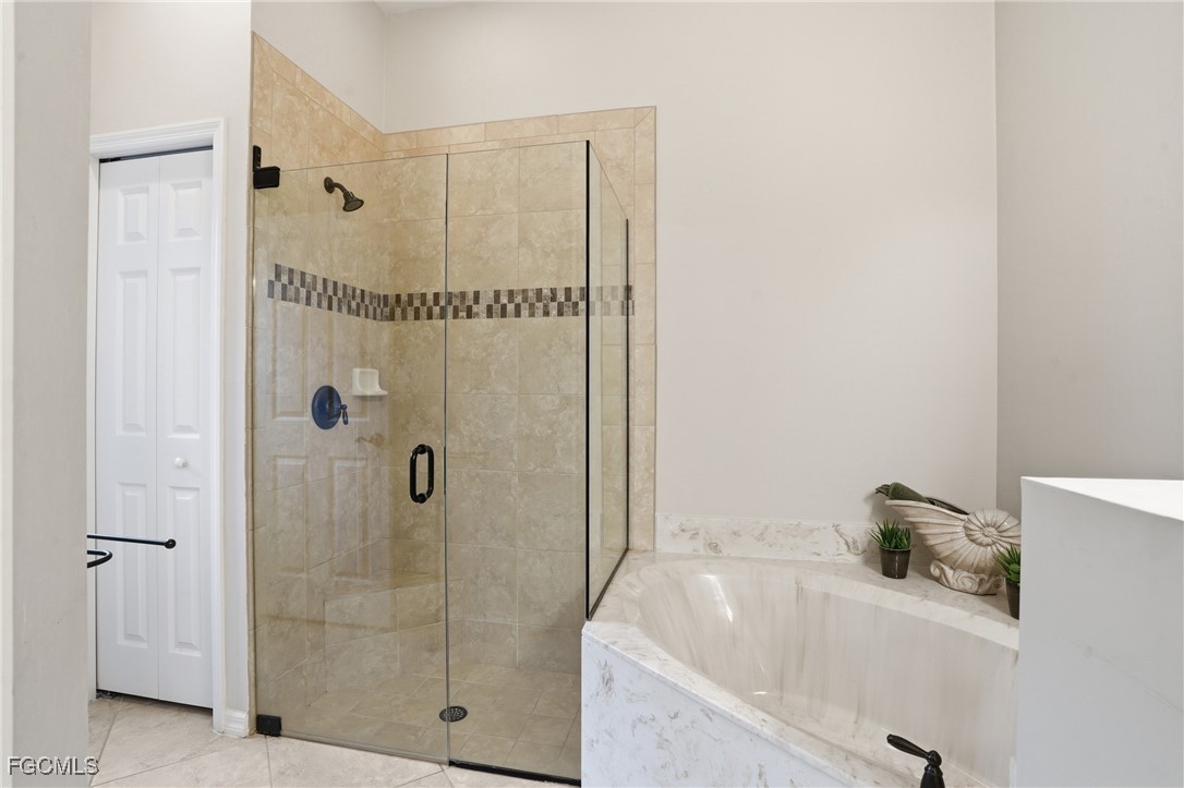 20604 Chestnut Ridge Drive North Fort Myers, FL 33917 - Photo 24 of 49 a bathroom with a tub and shower