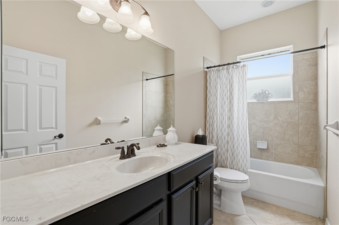 20604 Chestnut Ridge Drive North Fort Myers, FL 33917 - Photo 28 of 49 a bathroom with a sink a toilet and shower