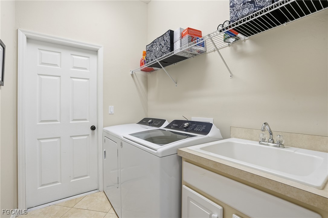 20604 Chestnut Ridge Drive North Fort Myers, FL 33917 - Photo 31 of 49 a utility room with dryer and washer