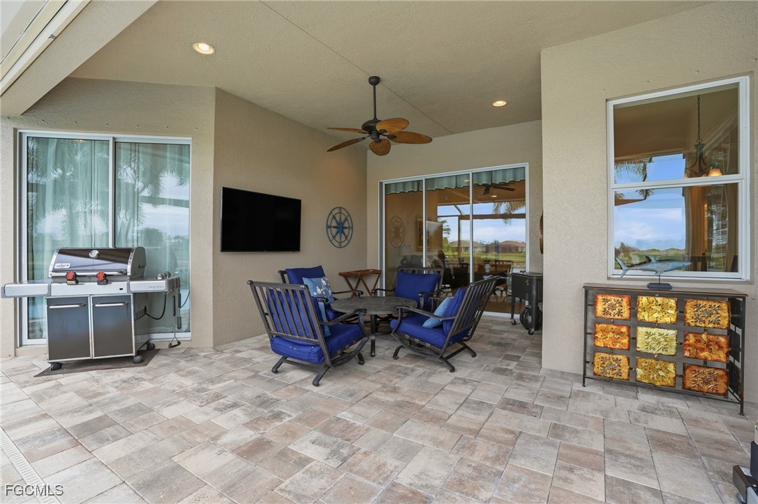 20604 Chestnut Ridge Drive North Fort Myers, FL 33917 - Photo 34 of 49 a living room with furniture and a flat screen tv