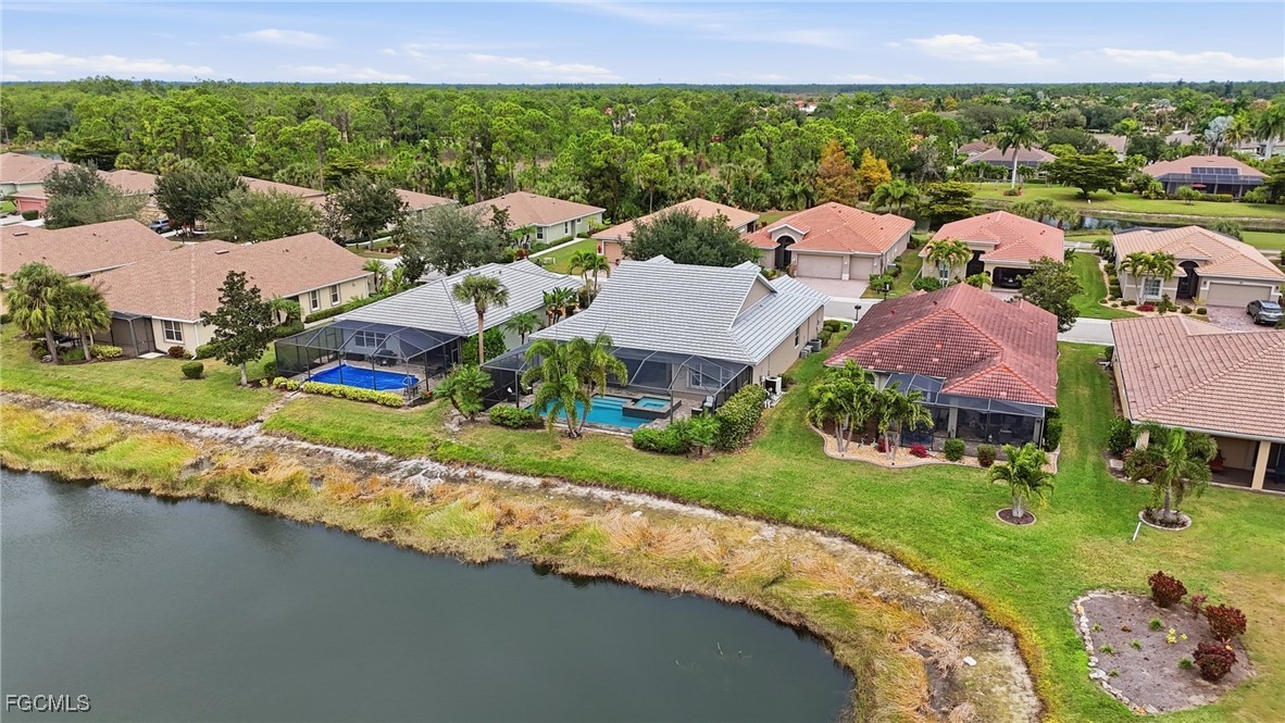 20604 Chestnut Ridge Drive North Fort Myers, FL 33917 - Photo 42 of 49 an aerial view of a house with a garden and lake view
