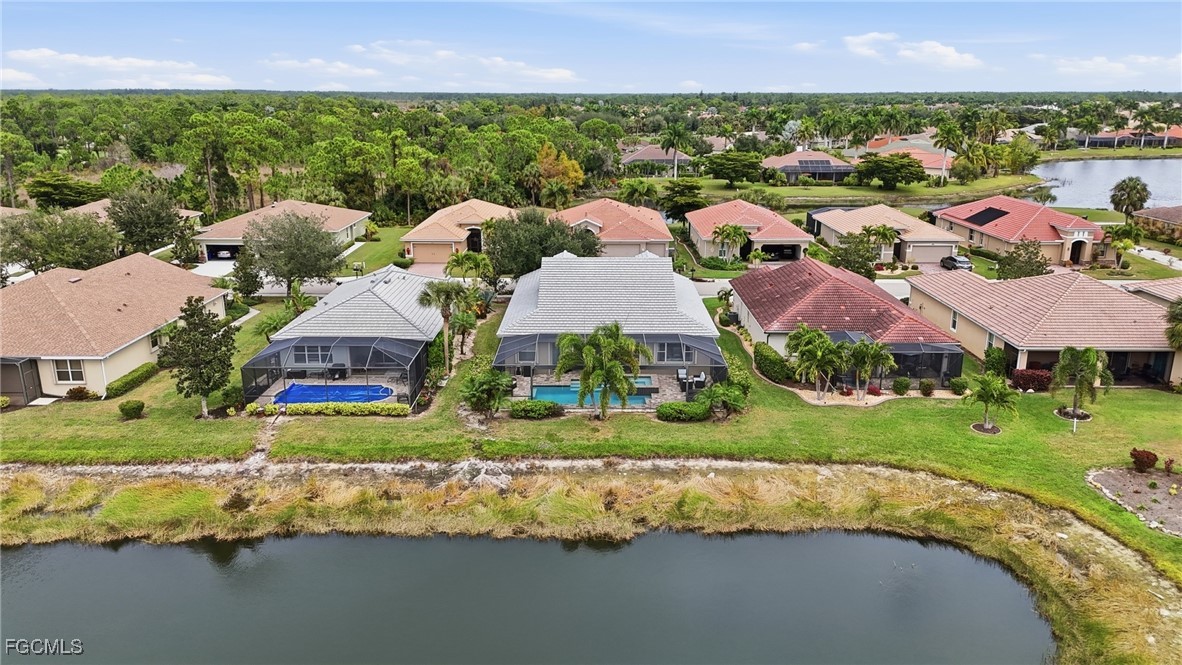 20604 Chestnut Ridge Drive North Fort Myers, FL 33917 - Photo 43 of 49 an aerial view of a house with a yard and lake