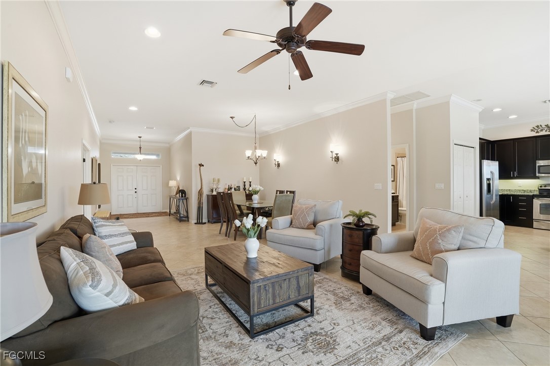 20604 Chestnut Ridge Drive North Fort Myers, FL 33917 - Photo 5 of 49 a living room with furniture and a view of kitchen
