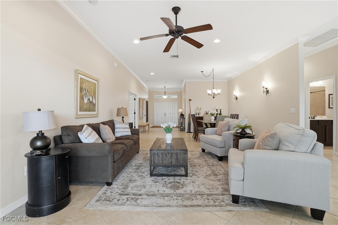 20604 Chestnut Ridge Drive North Fort Myers, FL 33917 - Photo 6 of 49 a living room with furniture and a ceiling fan