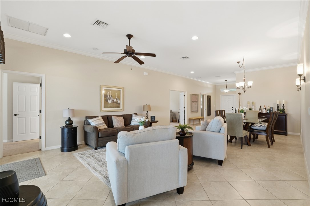 20604 Chestnut Ridge Drive North Fort Myers, FL 33917 - Photo 8 of 49 a living room with furniture and a chandelier