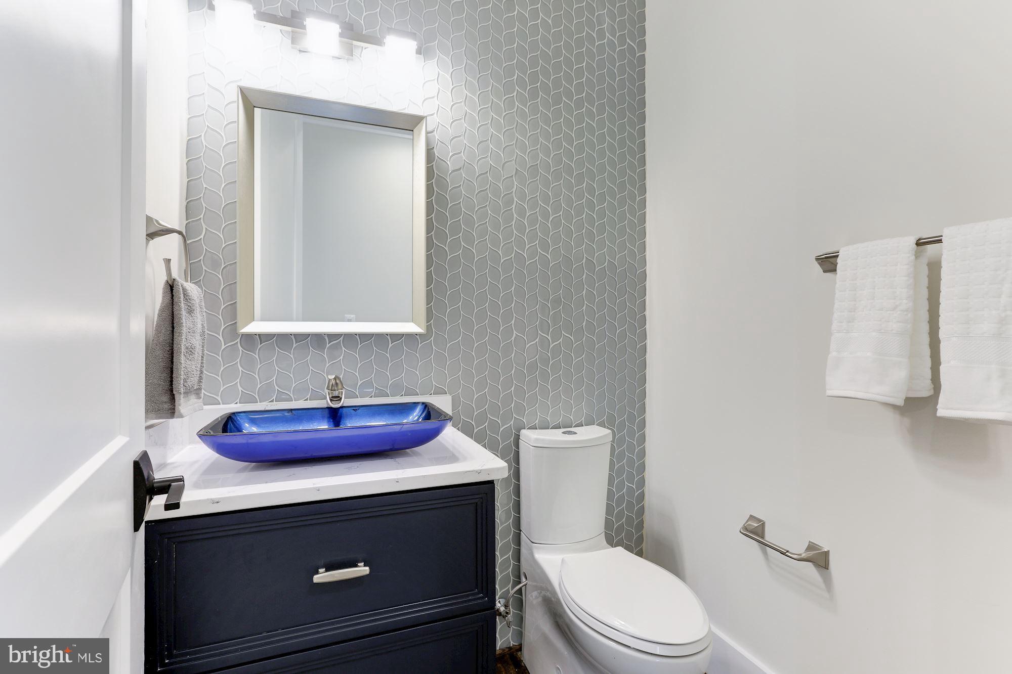 6834 Churchill Road McLean, VA 22101 - Photo 43 of 110 Powder Room with Glass-tiled Accent Wall