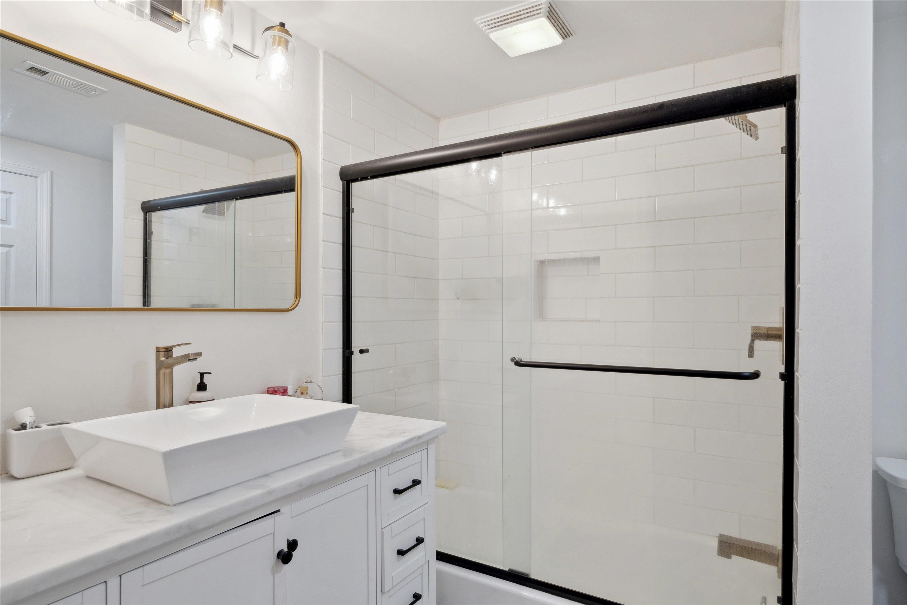 940 Greencliff Road Collierville, TN 38017 - Photo 14 of 23 a bathroom with a sink and mirror