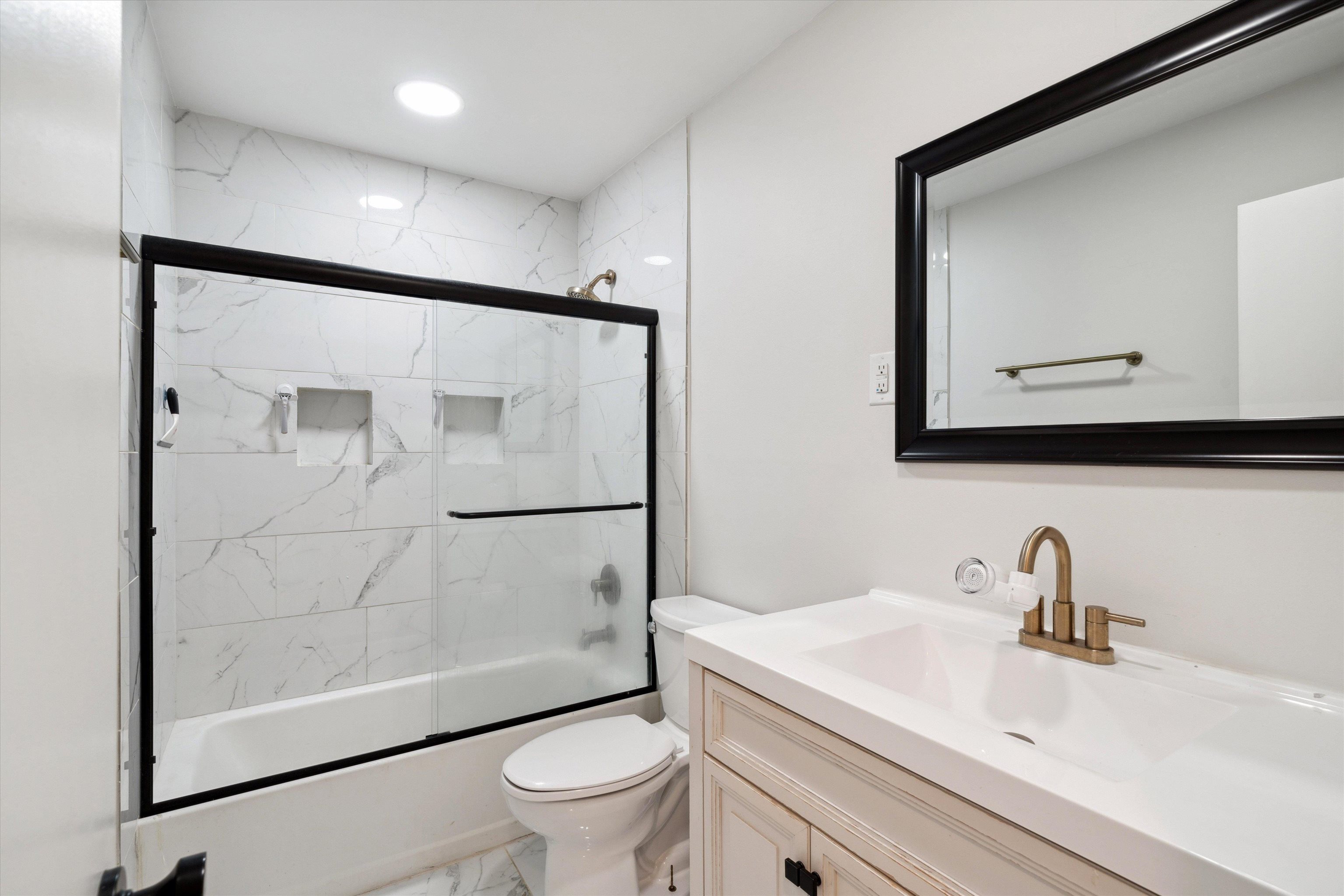 940 Greencliff Road Collierville, TN 38017 - Photo 18 of 23 a bathroom with a sink toilet and shower