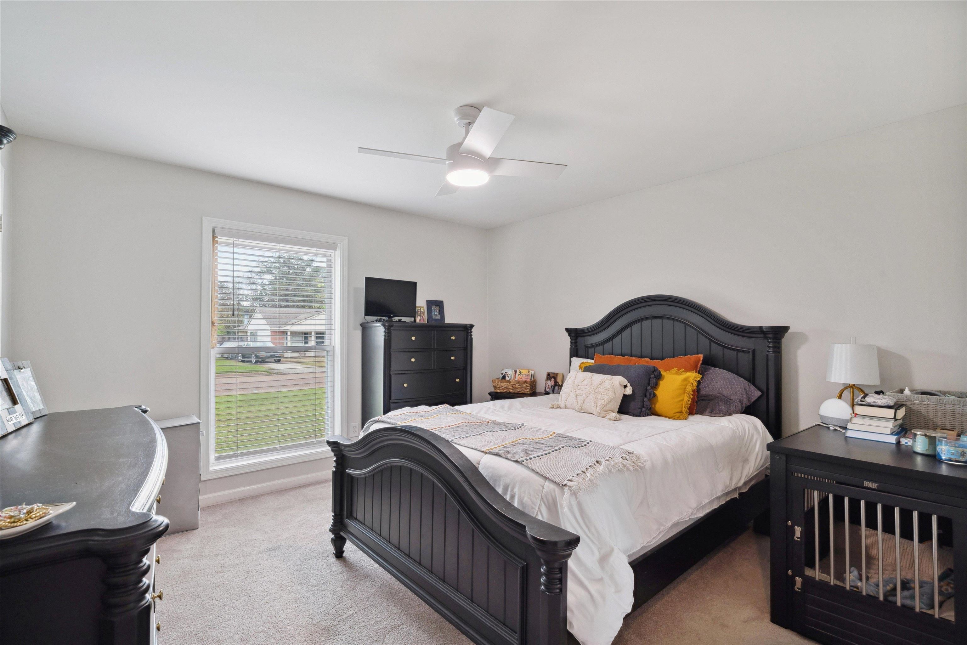 940 Greencliff Road Collierville, TN 38017 - Photo 19 of 23 a bedroom with a bed and a large window