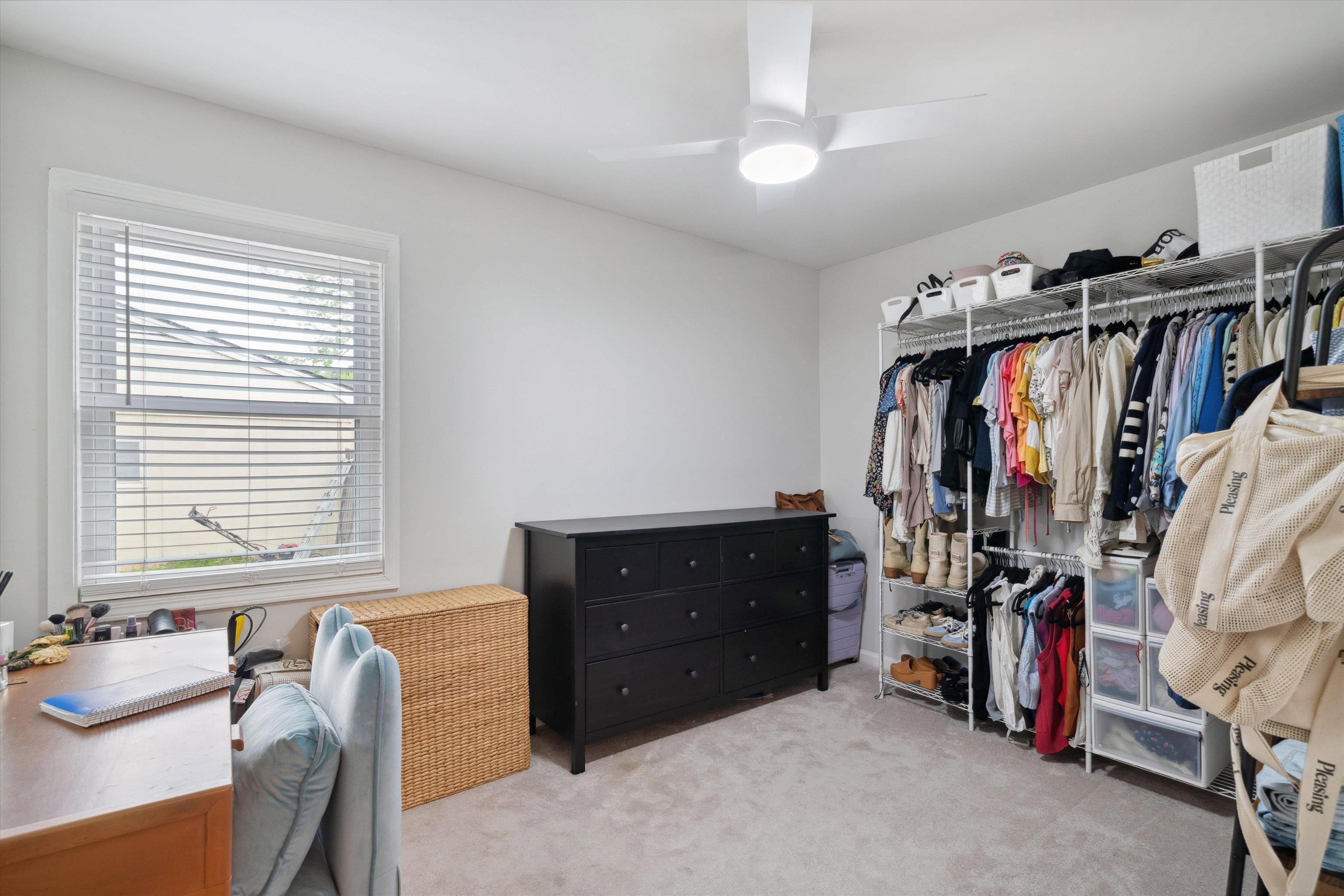 940 Greencliff Road Collierville, TN 38017 - Photo 20 of 23 a view of a bedroom with clothes and shoes
