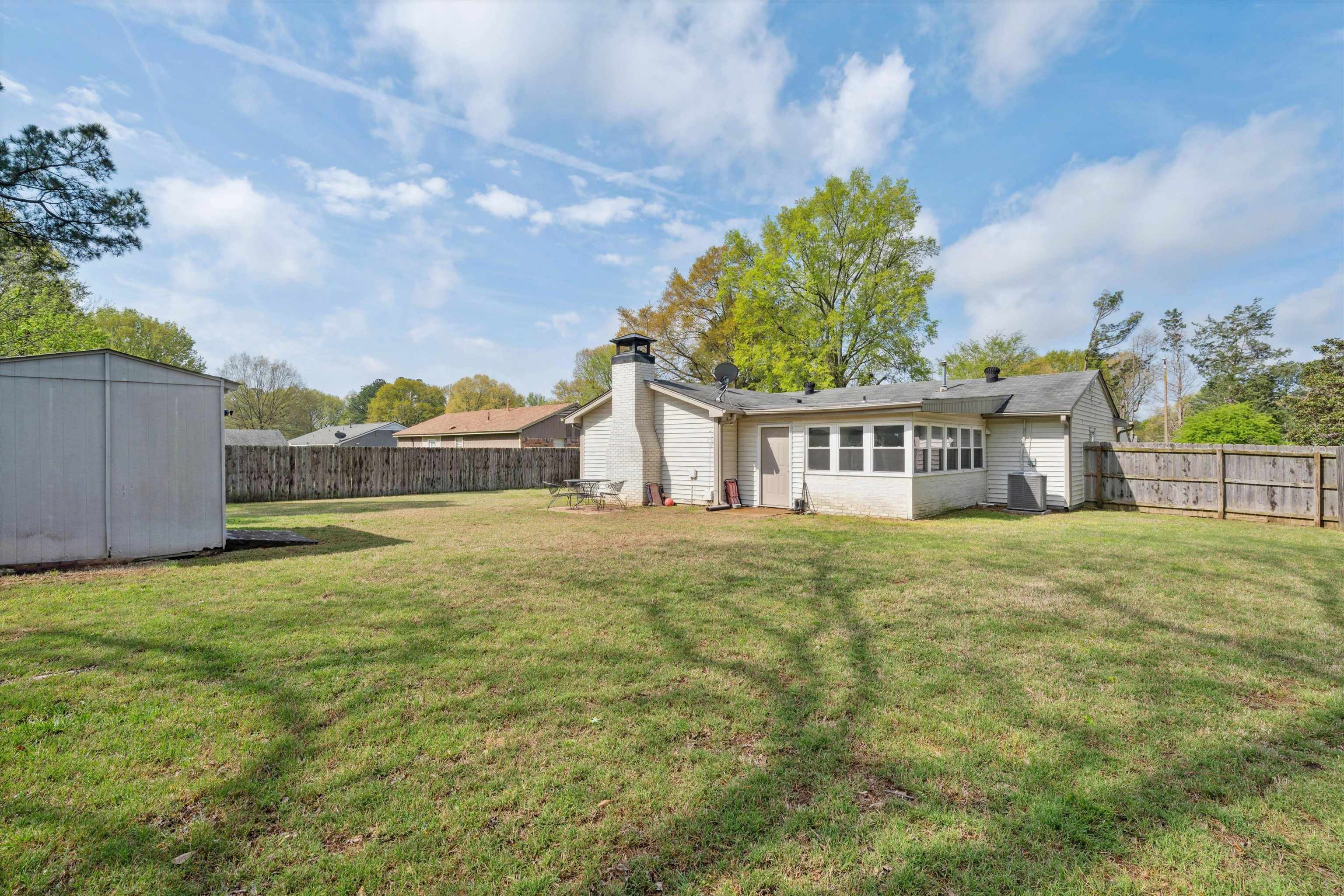 940 Greencliff Road Collierville, TN 38017 - Photo 22 of 23 a view of a house with a yard and a garden