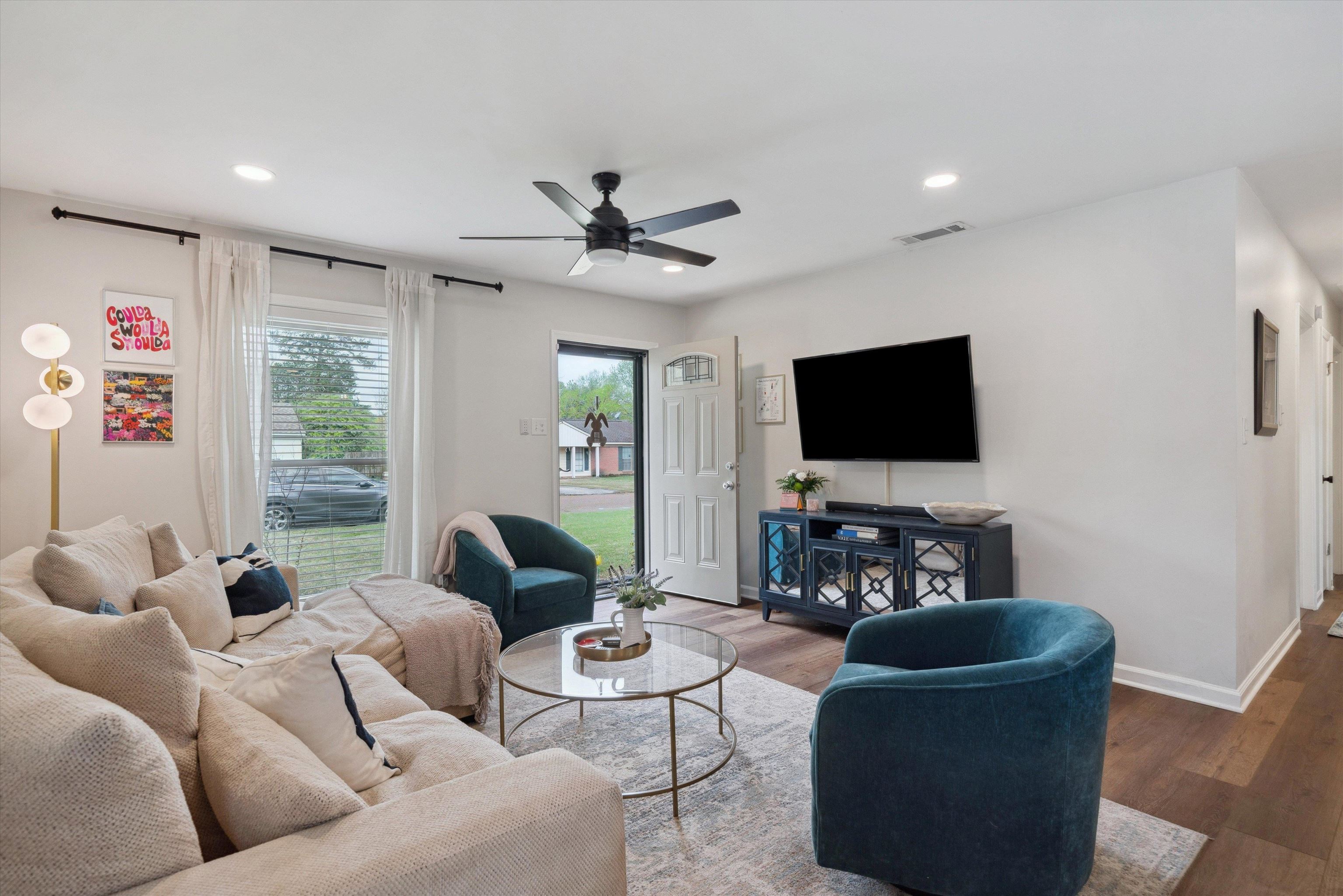 940 Greencliff Road Collierville, TN 38017 - Photo 5 of 23 a living room with furniture and a flat screen tv