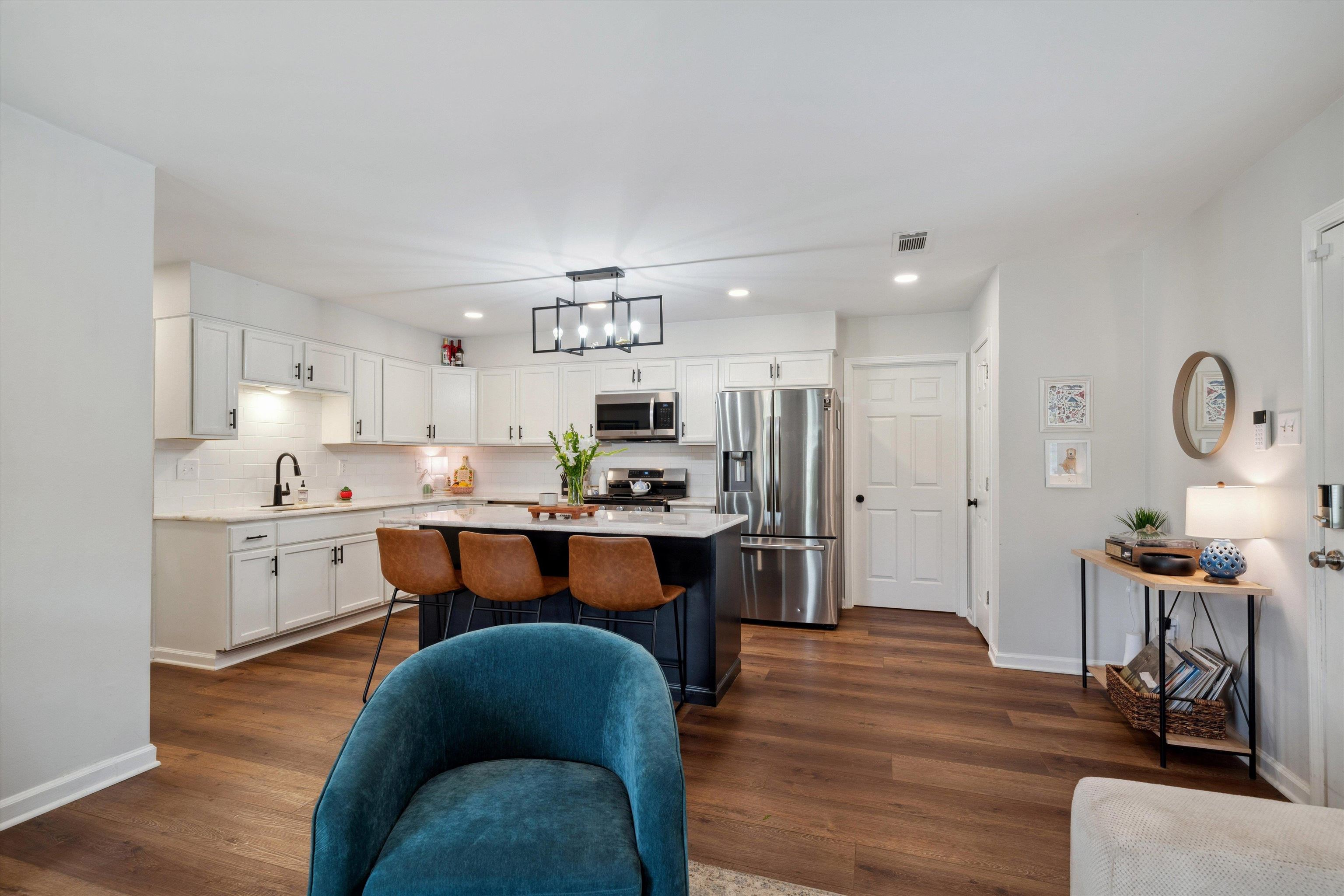 940 Greencliff Road Collierville, TN 38017 - Photo 6 of 23 a kitchen with kitchen island granite countertop a sink cabinets and wooden floor