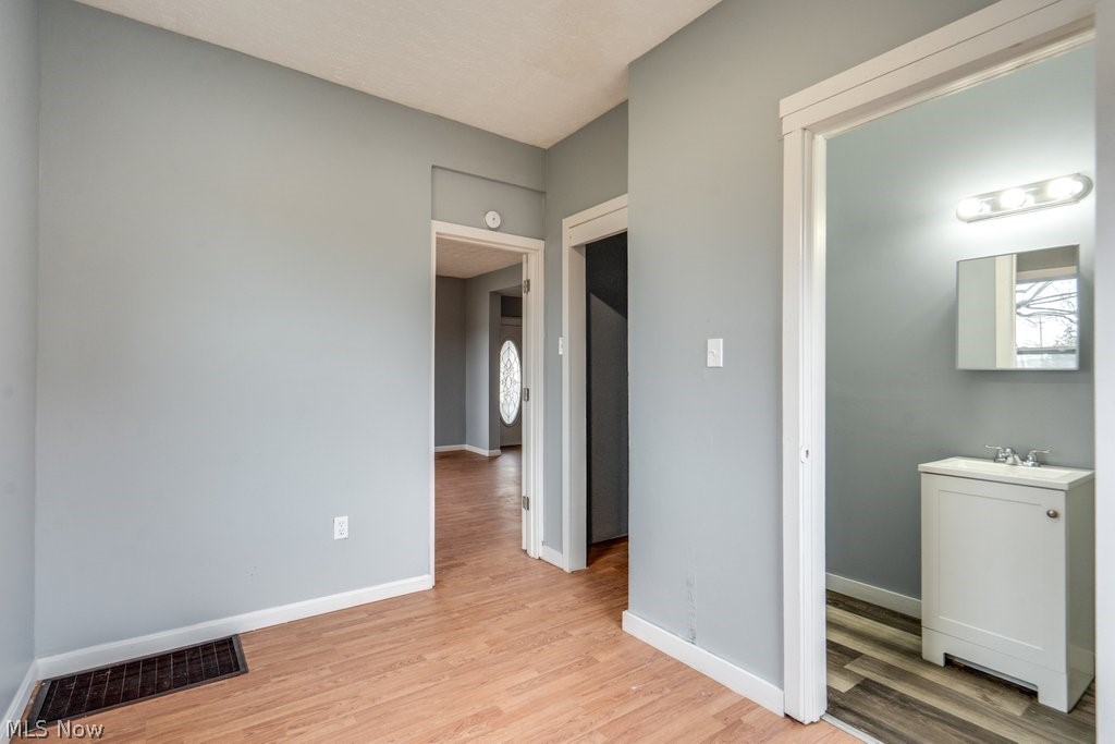 1607 9th Street Southwest Canton, OH 44706 - Photo 13 of 41 Room featuring neutral gray walls and wood-finish flooring