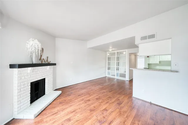 a view of kitchen and entryway with wooden floor