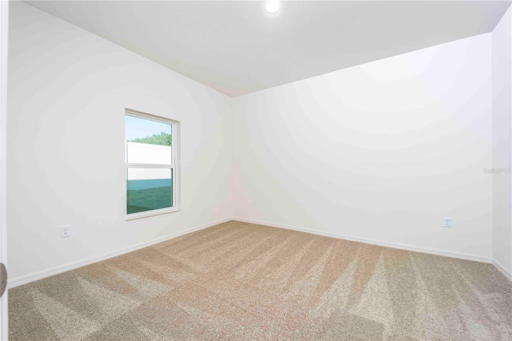 13486 Leaping Water Way Astatula, FL 34705 - Photo 12 of 20 an empty room with a window