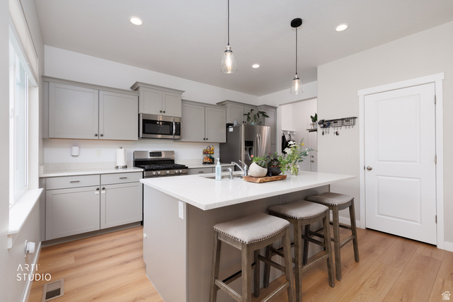 1654 South 730 West Provo, UT 84601 - Photo 10 of 33 Kitchen featuring light wood-finish flooring, recessed lighting, and a window providing natural illumination