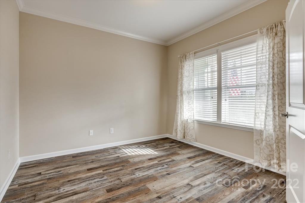 3142 Amaranth Drive Tega Cay, SC 29708 - Photo 5 of 47 a view of empty room with wooden floor and fan