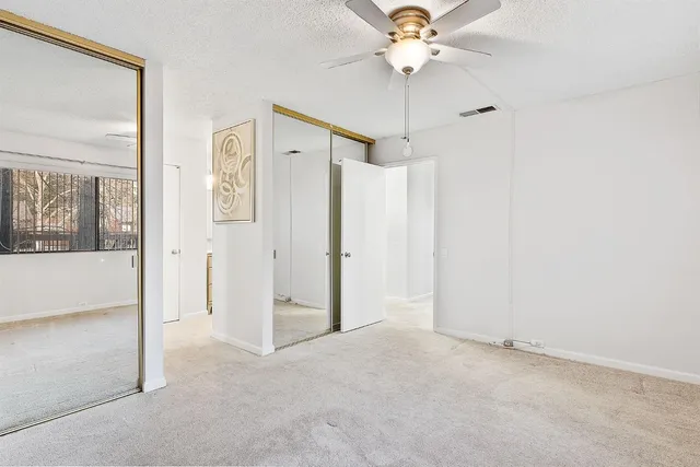 a couple of cars parked in front of a house