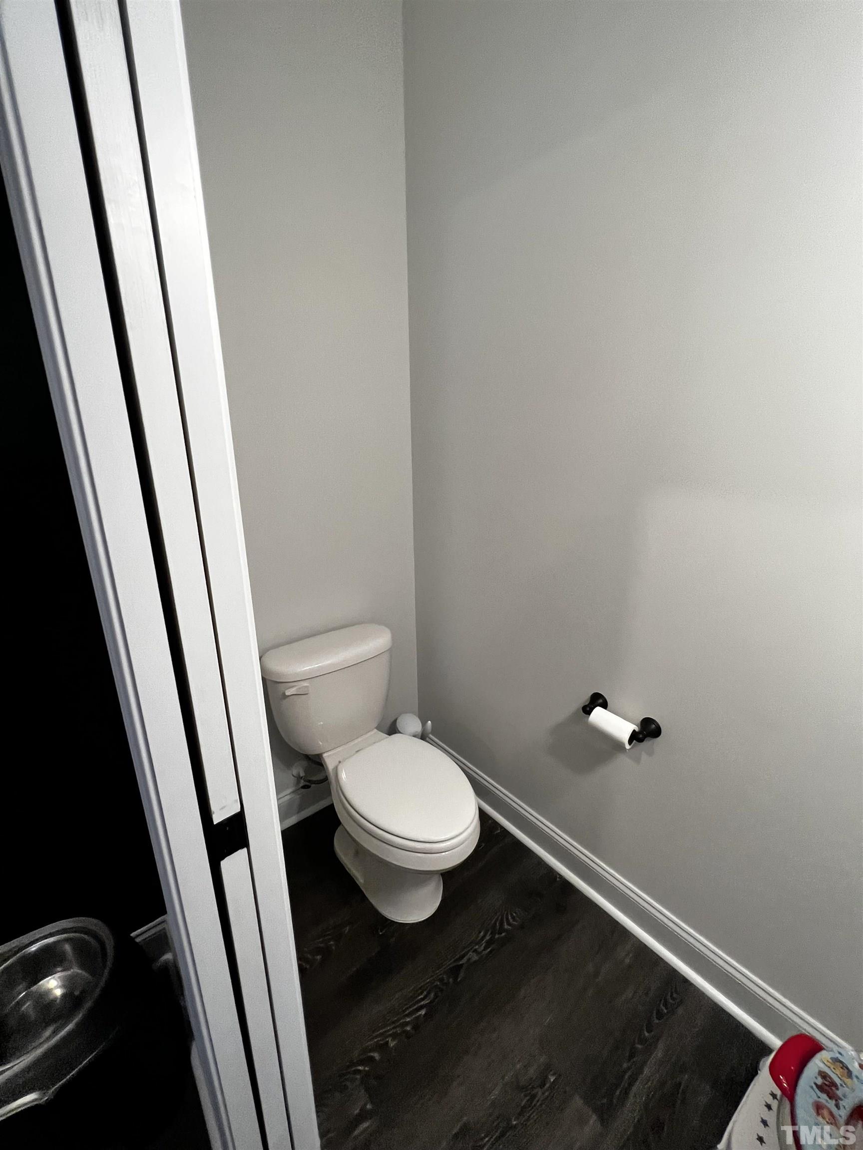 5647 Stewart Road Wade, NC 28395 - Photo 22 of 85 a white toilet sitting next to a sink
