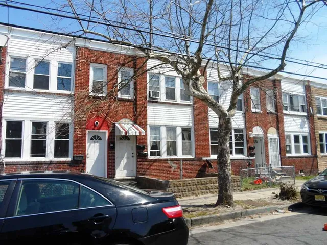 a view of a building with car parked