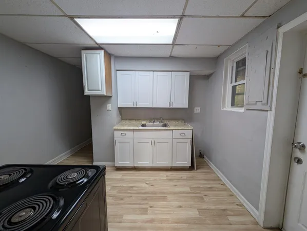 a kitchen with a stove and a refrigerator