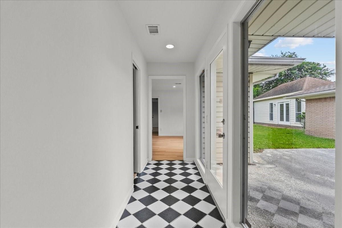 5762 Birdwood Road Houston, TX 77096 - Photo 29 of 49 DON'T YOU JUST LOVE THIS CHECKERED HALLWAY! IT GOES FROM THE MAIN KITCHEN TO THE MOTHER-IN-LAW SUITE, OR POP OUT TO YOUR PATIO AREA.