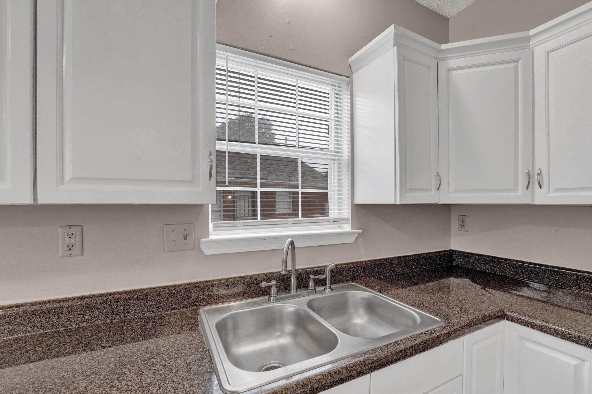 6309 Ragan Farm Drive Memphis, TN 38141 - Photo 14 of 25 Kitchen with white cabinetry and sink